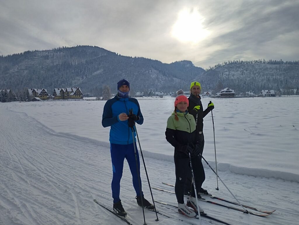 May be an image of 2 people and people skiing