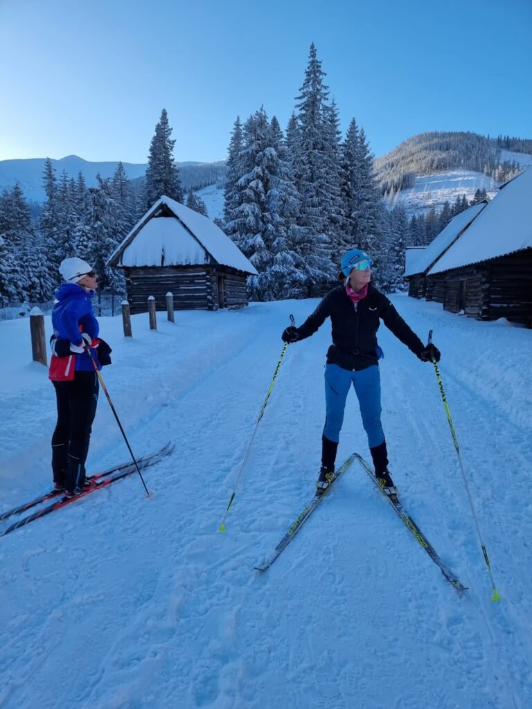 May be an image of 2 people and people skiing