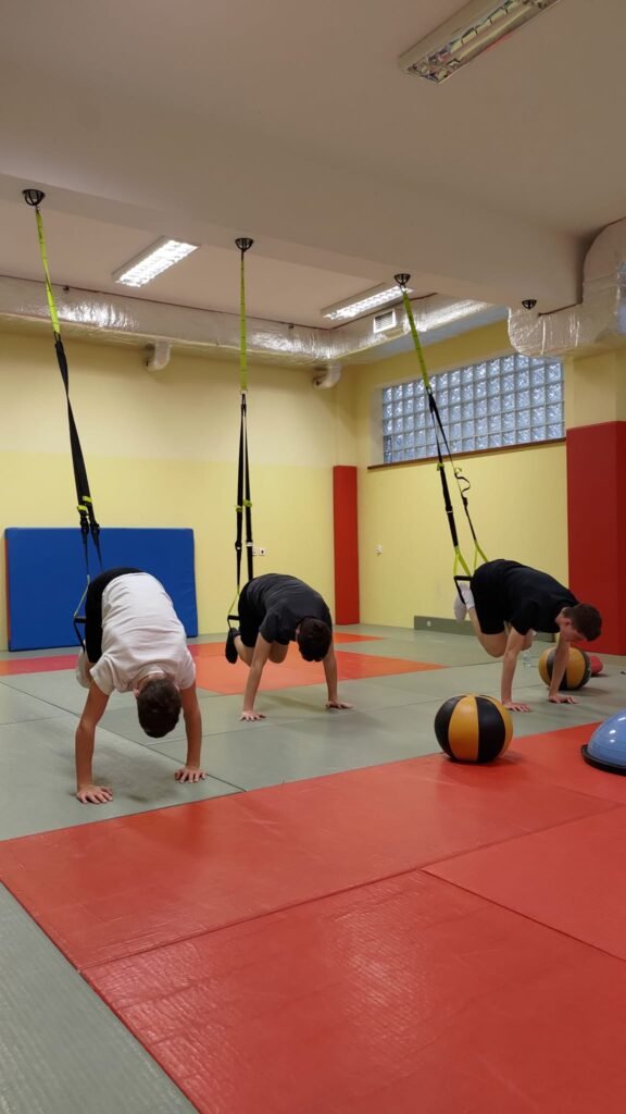 May be an image of 3 people, people performing martial arts and people practicing yoga