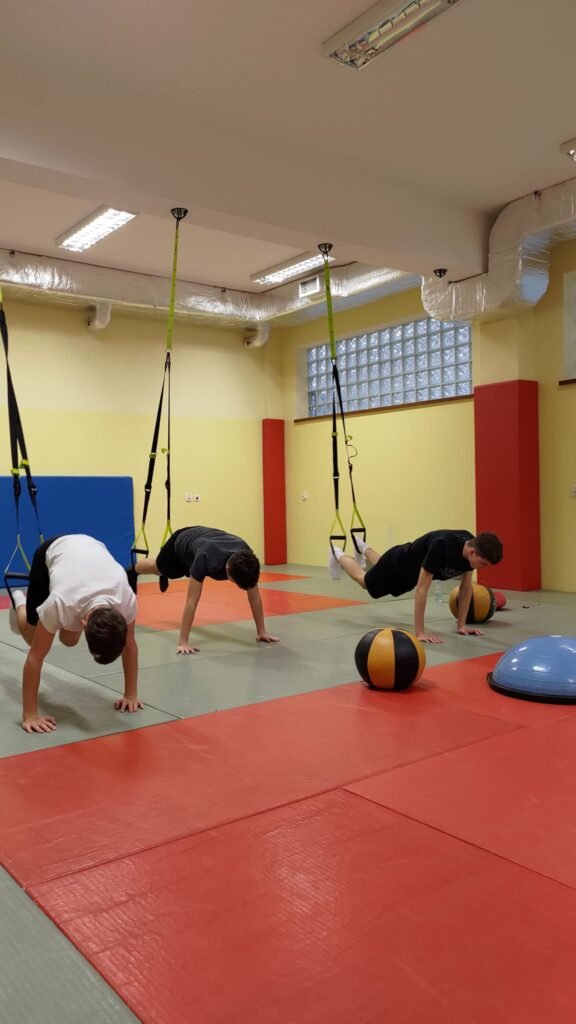 May be an image of 3 people and people practicing yoga