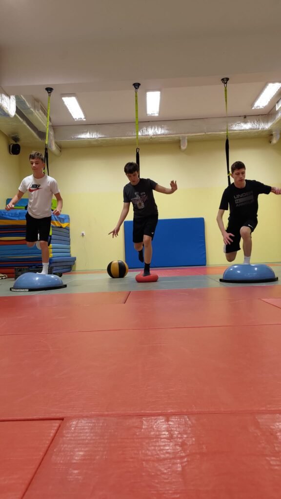 May be an image of 3 people, people playing basketball and trampoline