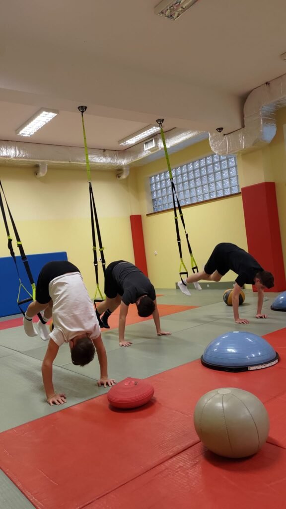 May be an image of 3 people and people practicing yoga