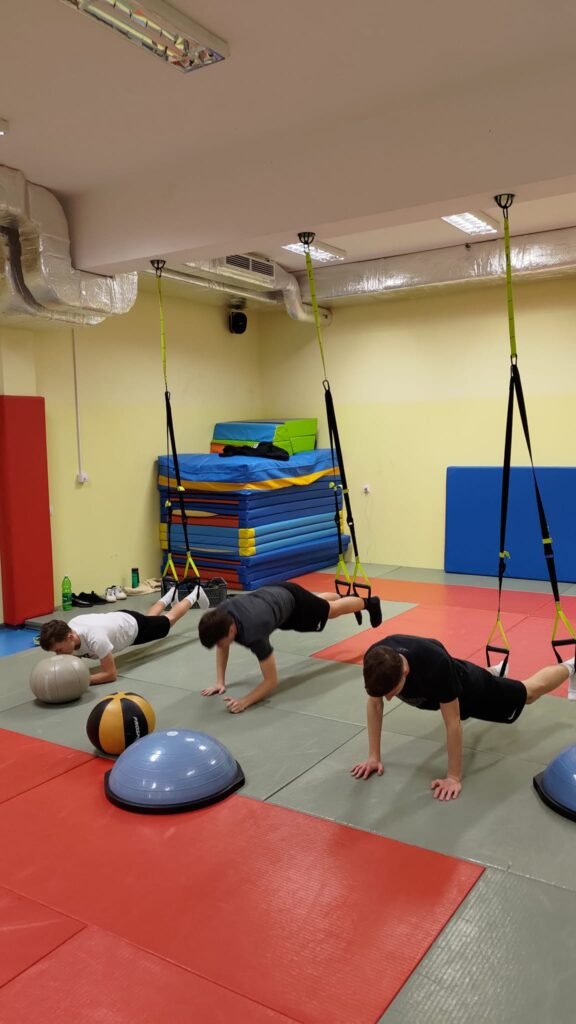 May be an image of 3 people and people practicing yoga