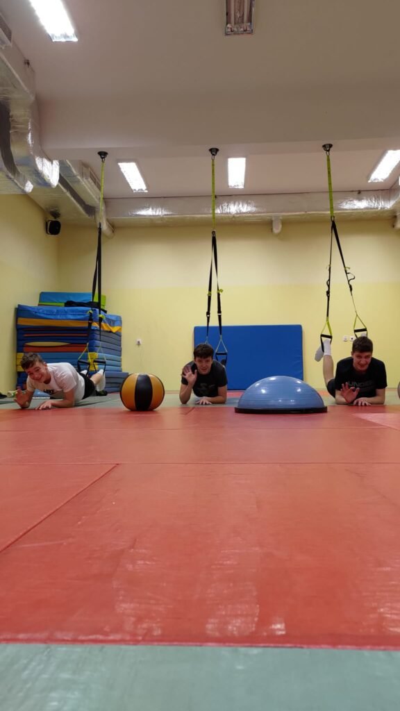 May be an image of 3 people and people practicing yoga