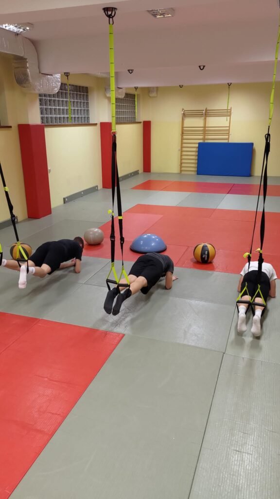 May be an image of 3 people and people practicing yoga